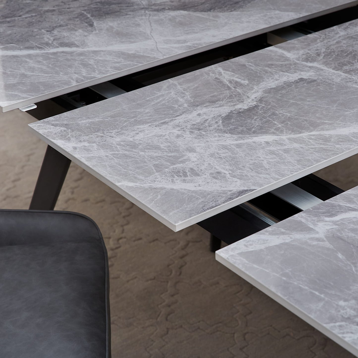 Modus Lucia Extendable Stone Top Metal Leg Dining Table in Piedra and Black
